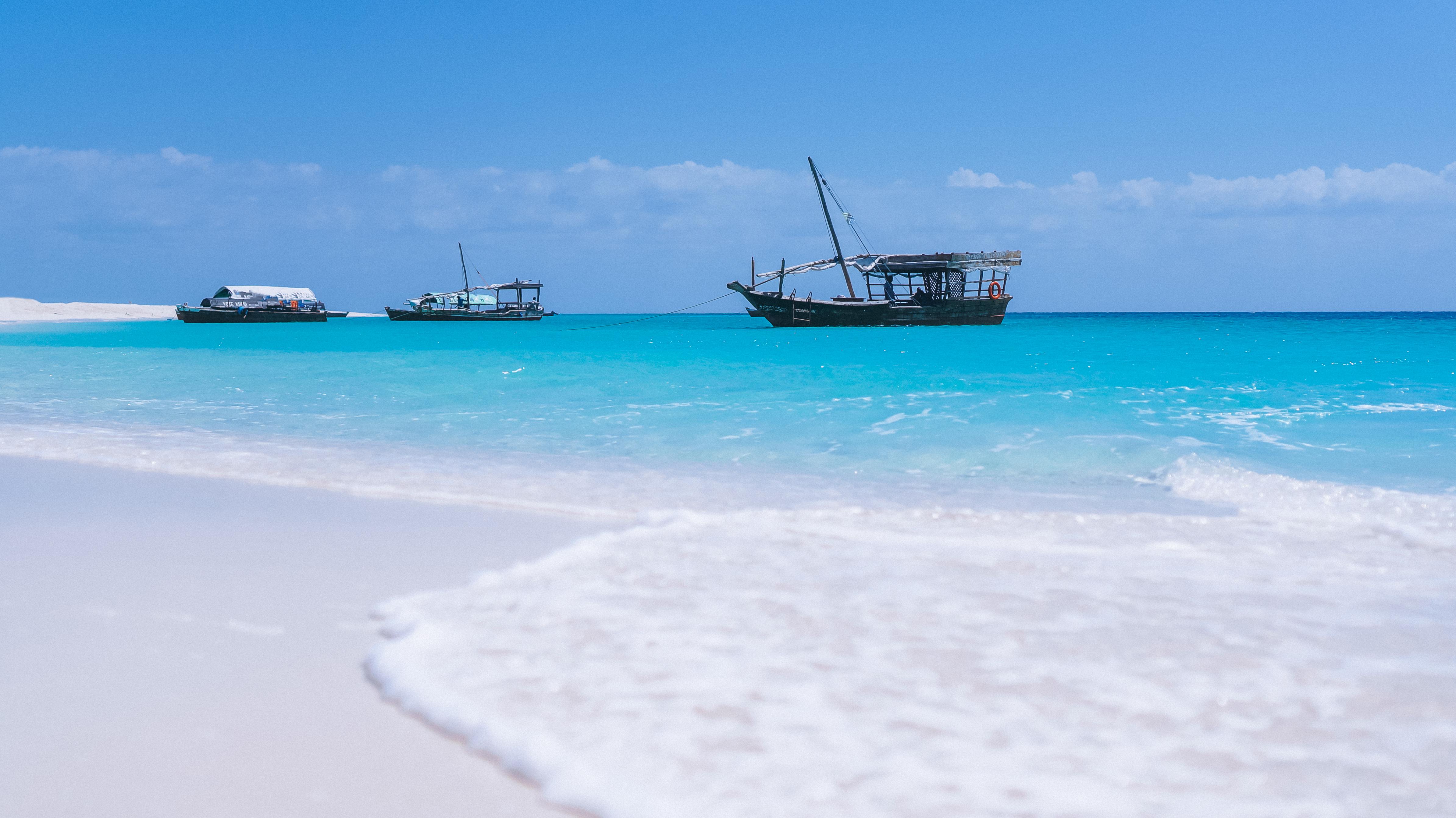 Beautiful Zanzibar beach with traditional dhow boats